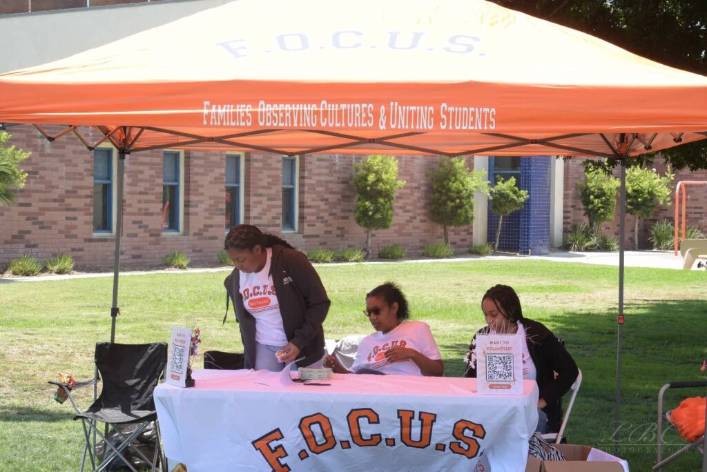 F.O.C.U.S. Safe Passage volunteers Informational booth at Juneteenth King Park 2025