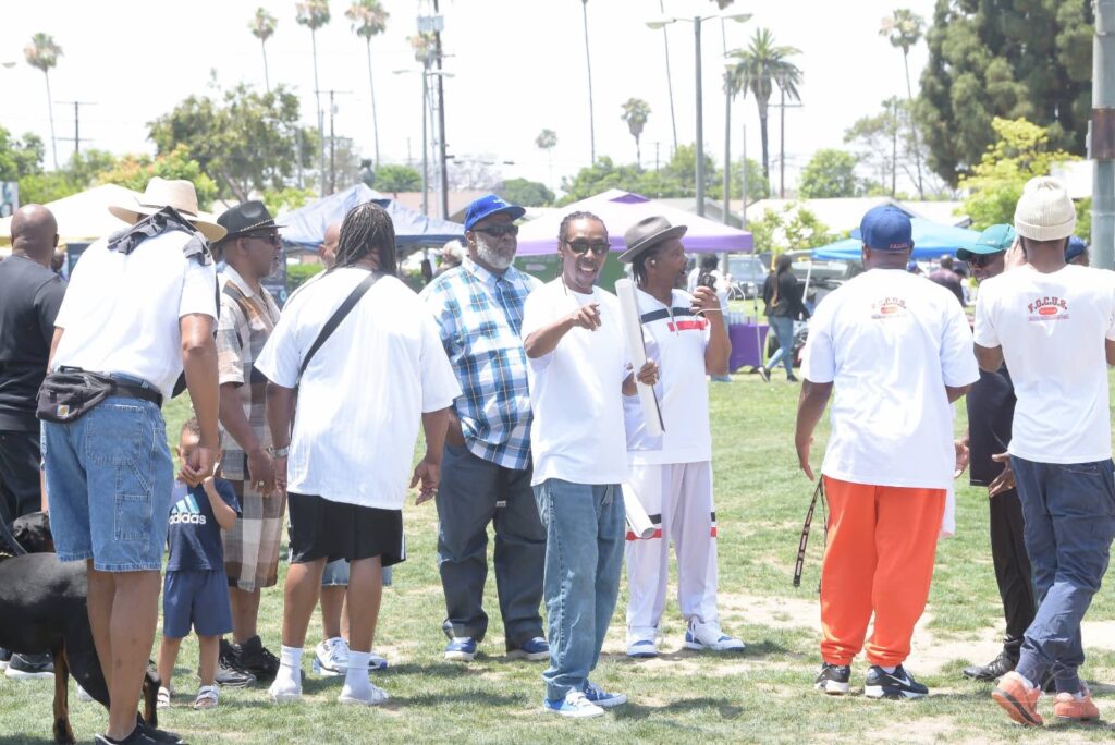 F.O.C.U.S. team handing out flyers at Juneteenth King Park celebration
